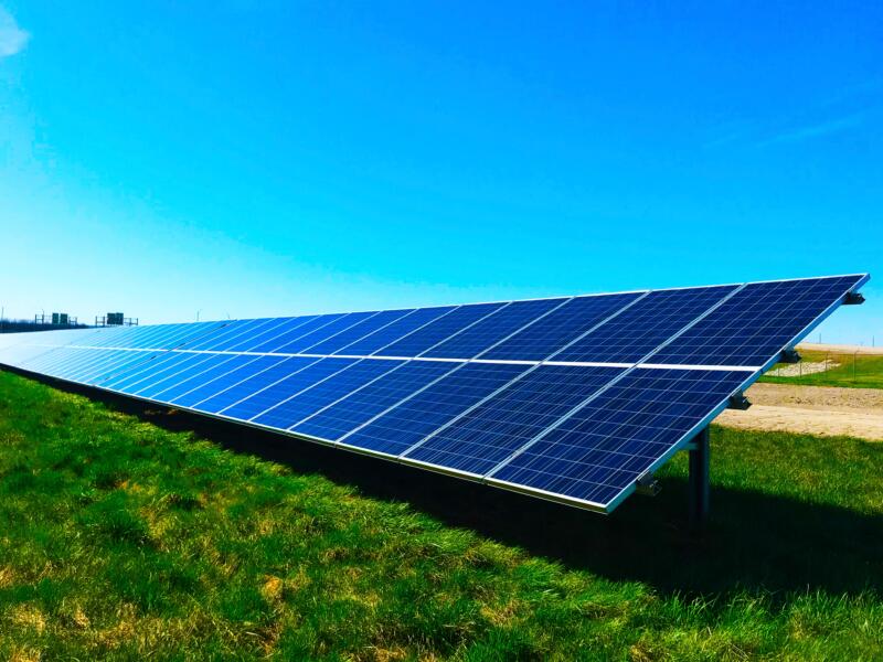 Field with blue solar panels