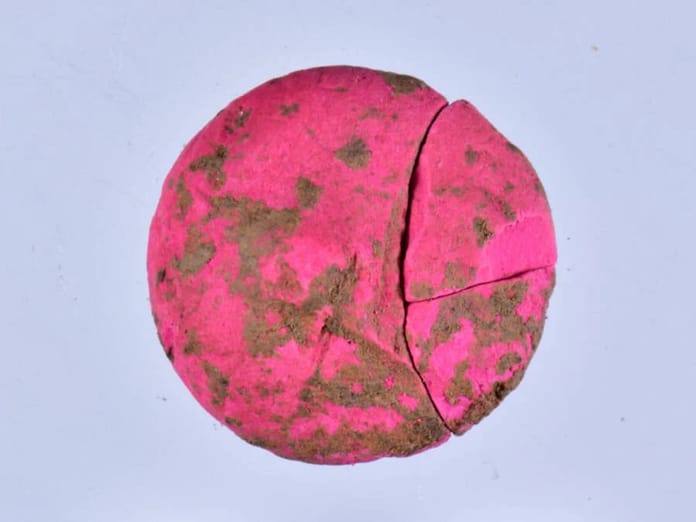 a block of makeup from 2000 years ago, the colour is pink