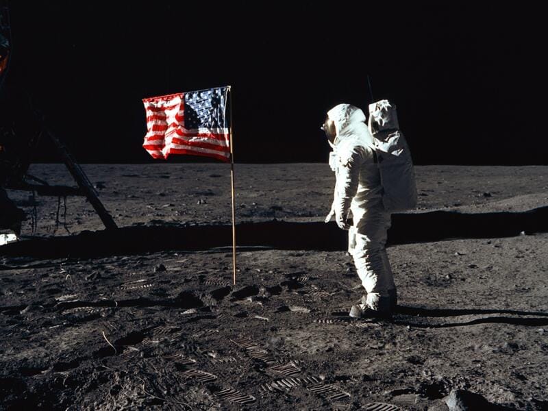 Astronaut Buzz Aldrin, lunar module pilot of the first lunar landing mission, poses for a photograph beside the deployed United States flag during an Apollo 11 Extravehicular Activity on the lunar surface