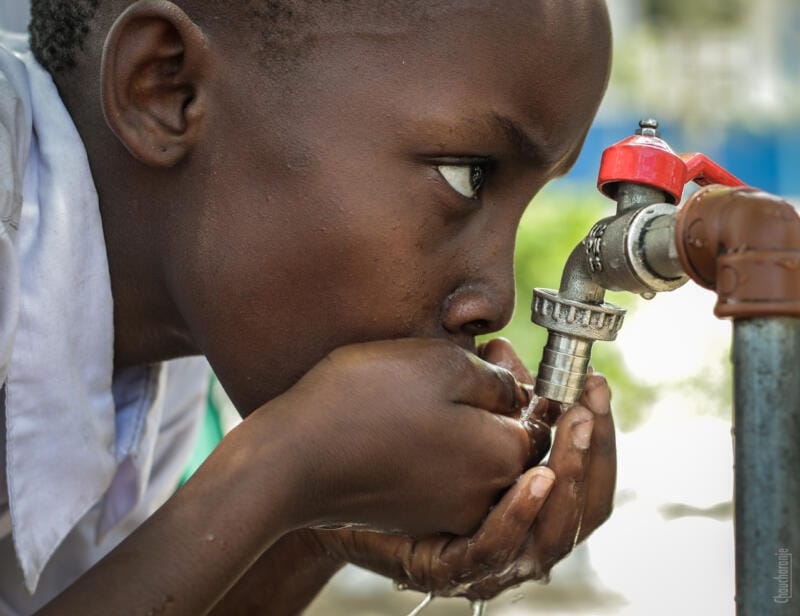 Boy accessing clean drinking water